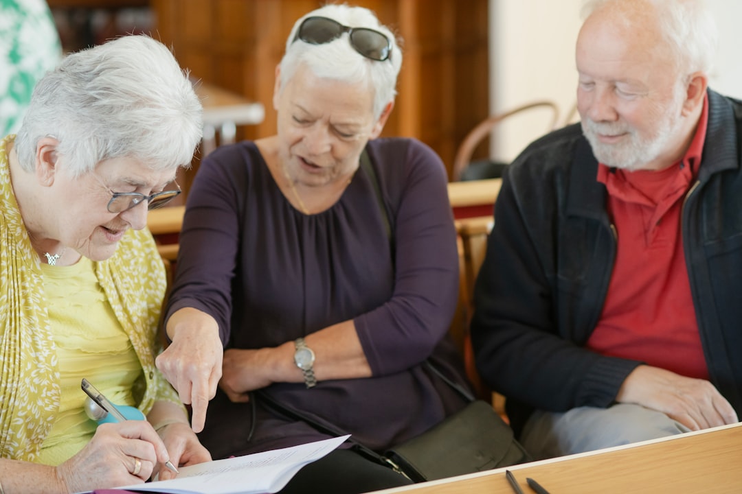 Older adults reviewing paperwork together, representing elderly voters navigating Nevada's new ID requirement