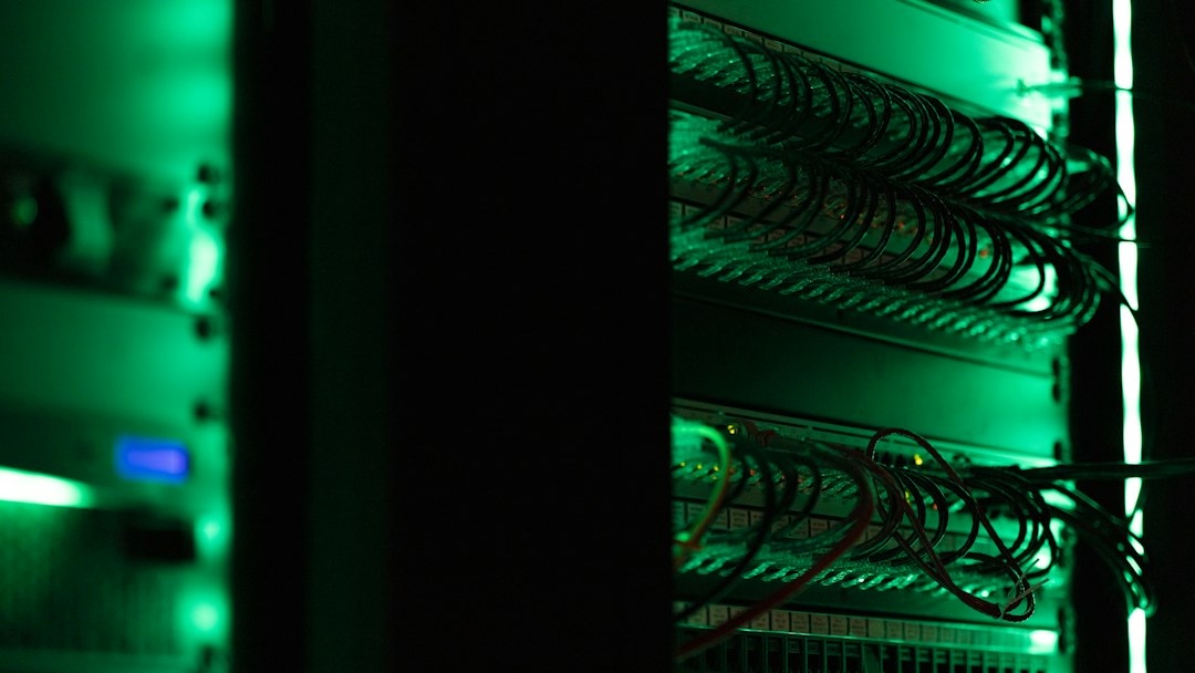 Rack of computer servers in a dark data room, the kind of systems election offices must back up and protect