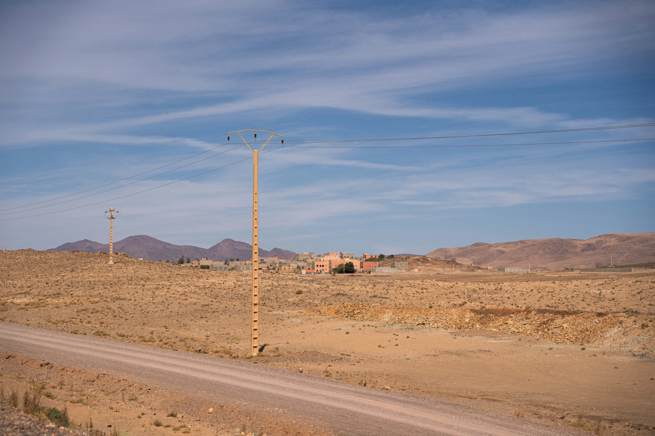 A small desert town with distant buildings and mountains, representing Nevada's rural communities