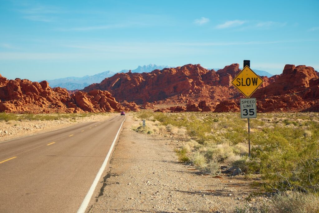 Desert highway road sign representing the distance rural and tribal Nevadans may travel to reach a DMV office